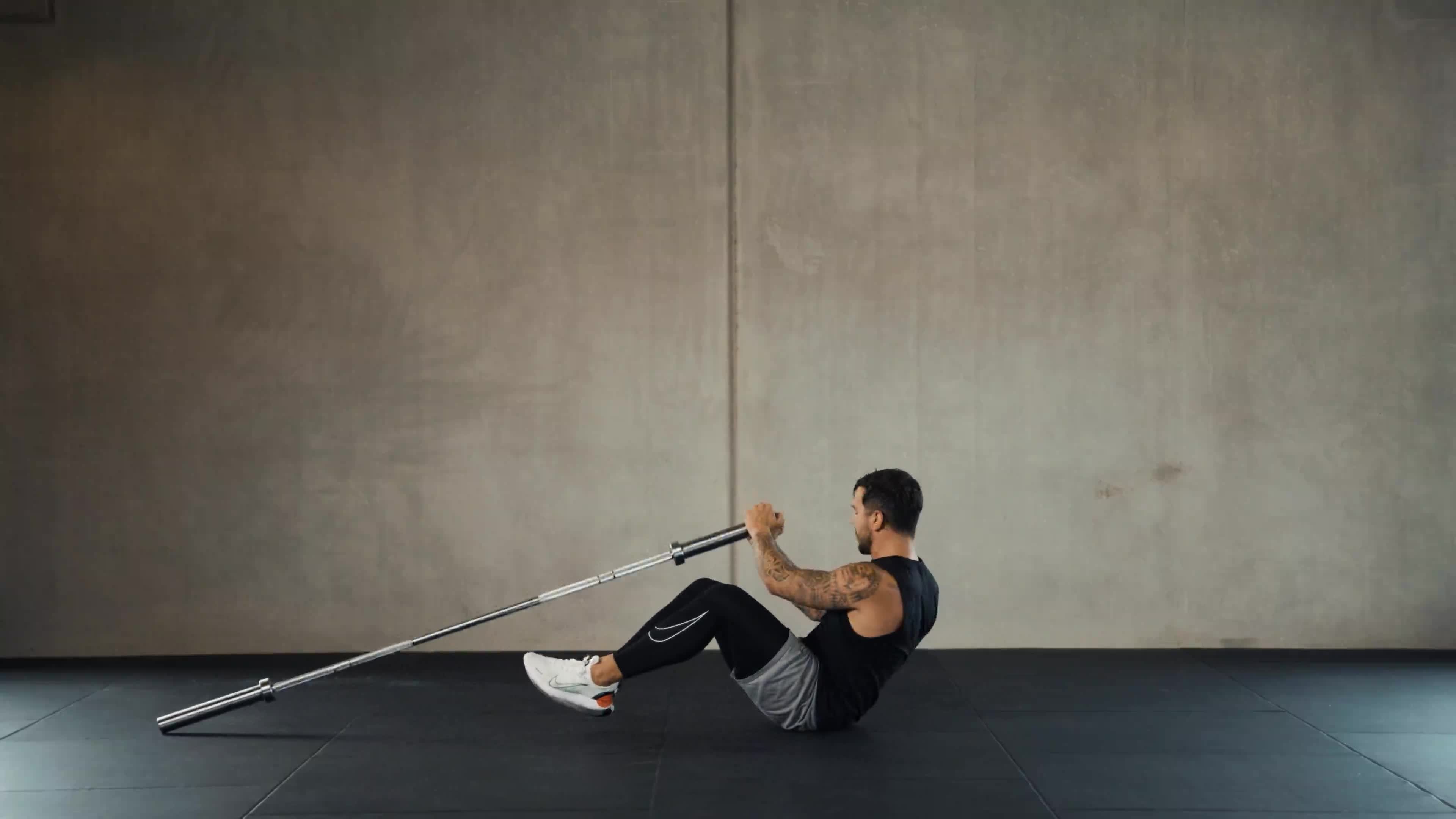 Loaded core work with a barbell